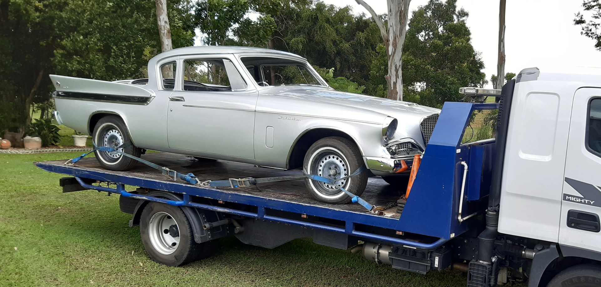 Classic silver Studebaker Hawk coupe being towed in Cleveland QLD