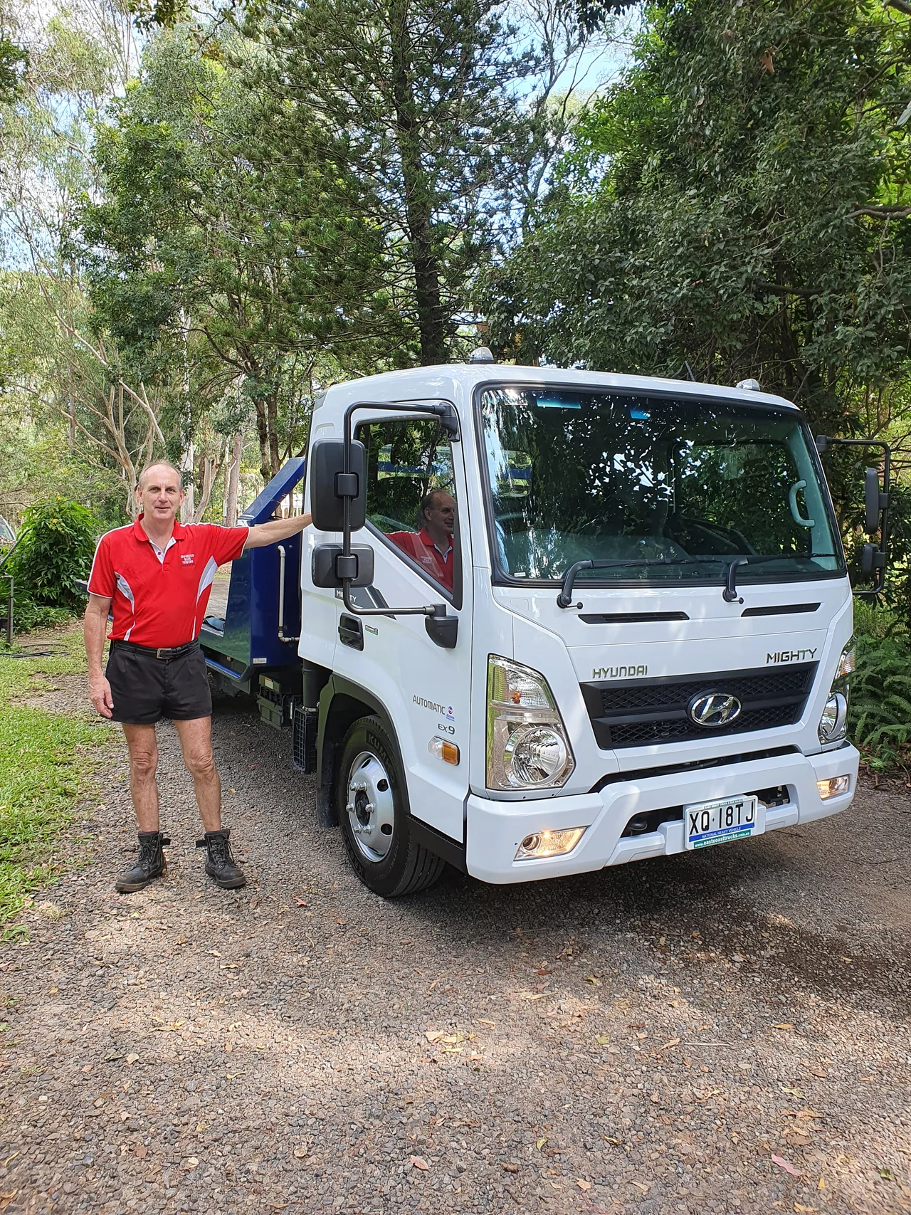 Richard beside the new white Hyundai Advanced Blue Towing tilt tray truck
